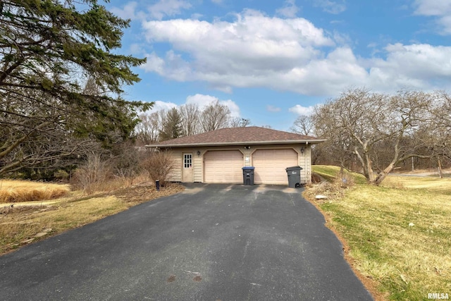 exterior space with aphalt driveway