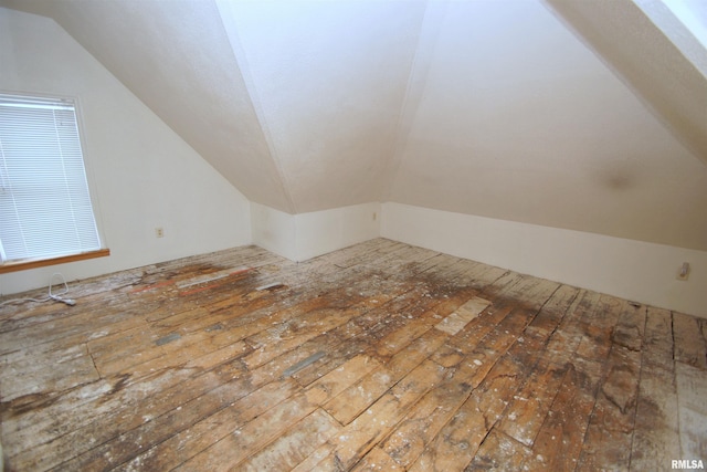 705 Brady St, Davenport, IA 52803 - additional living space with vaulted ceiling and hardwood / wood-style flooring
