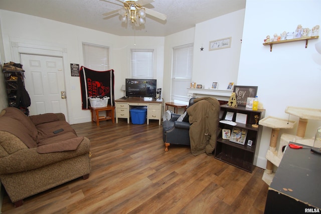 705 Brady St, Davenport, IA 52803 - living area with baseboards, a ceiling fan, and wood finished floors