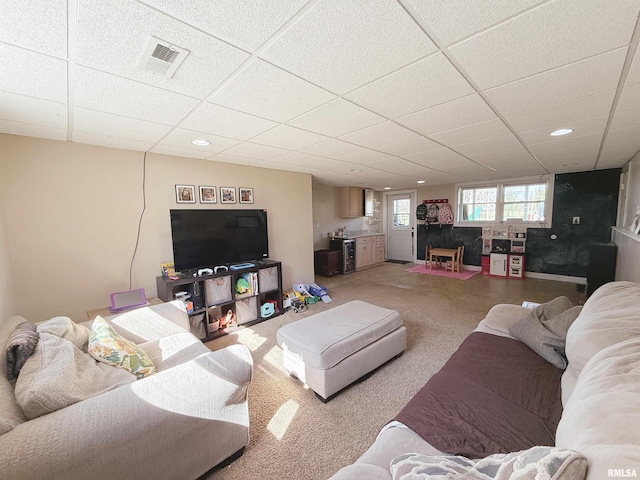 living room with recessed lighting, light carpet, visible vents, and a paneled ceiling