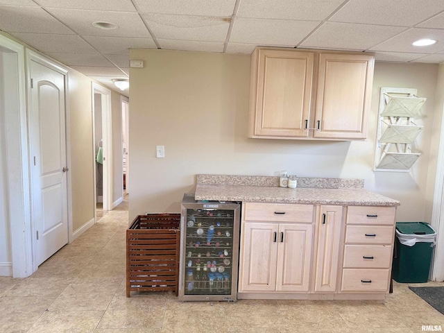 bar featuring wine cooler, recessed lighting, and a drop ceiling