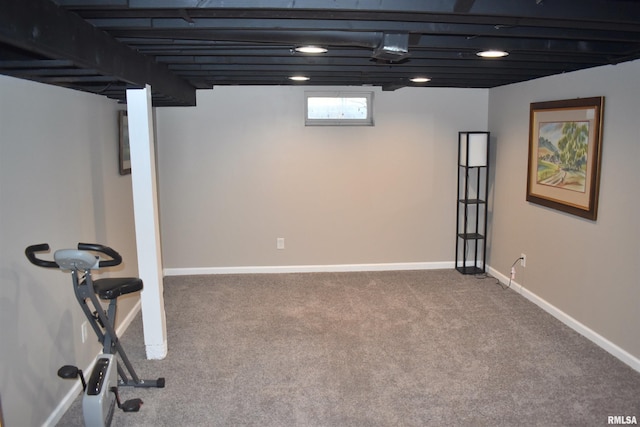 below grade area featuring carpet floors and baseboards