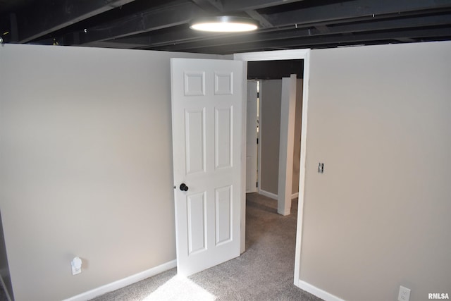 finished basement featuring carpet and baseboards