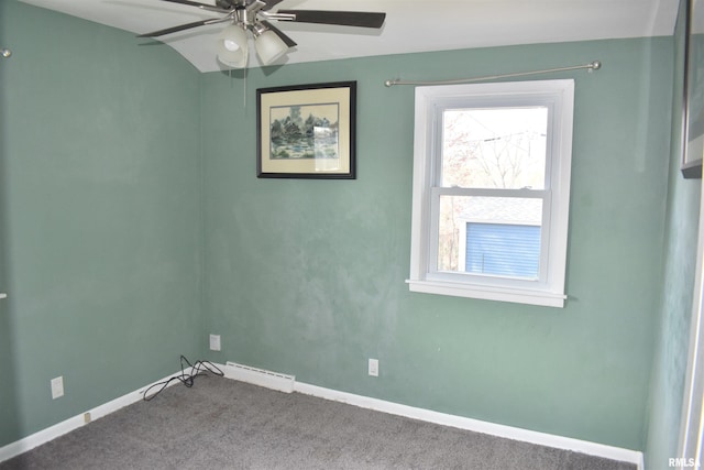 carpeted empty room featuring a ceiling fan and baseboards