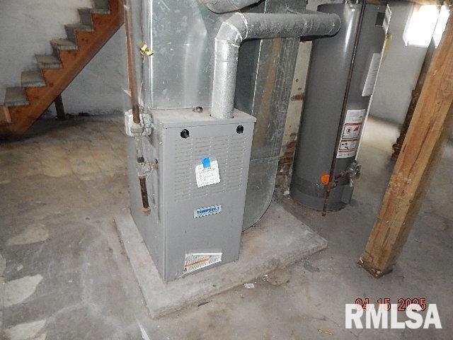 utilities with gas water heater and heating unit