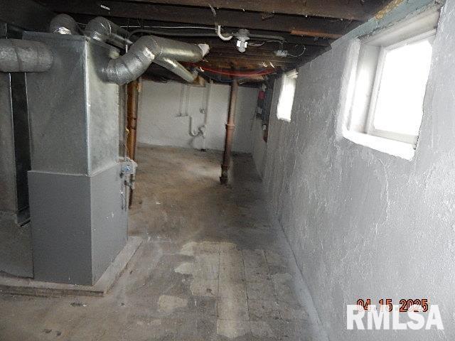 basement featuring heating unit