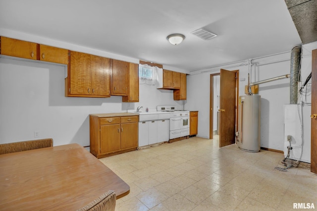 kitchen featuring brown cabinets, gas water heater, visible vents, and white range with gas stovetop