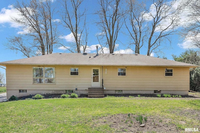 back of house with a yard and entry steps