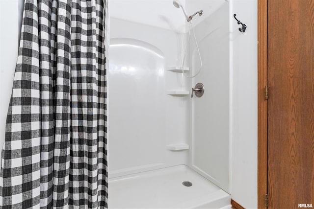 bathroom with a shower with shower curtain