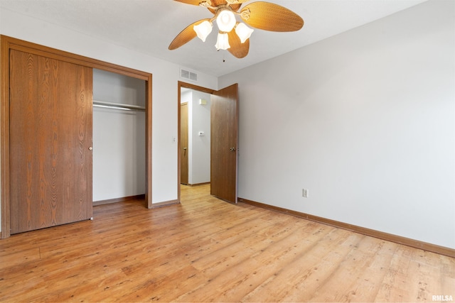 unfurnished bedroom featuring baseboards, light wood-style flooring, and visible vents