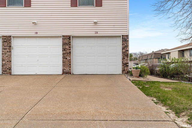 garage with concrete driveway