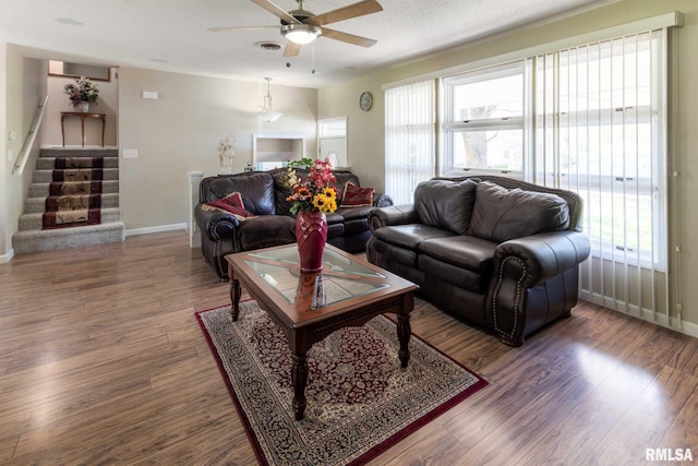 505 W College St, Energy, IL 62933 - living room featuring stairway, baseboards, a ceiling fan, and wood finished floors