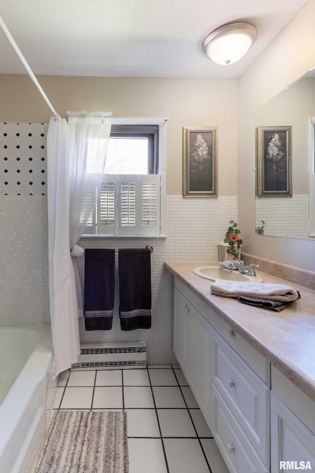 505 W College St, Energy, IL 62933 - full bathroom with a baseboard heating unit, shower / bath combo, tile walls, tile patterned flooring, and vanity