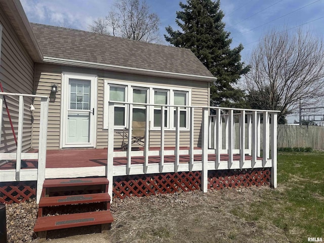 wooden terrace featuring fence