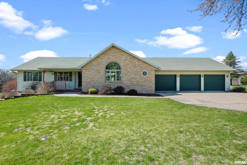 single story home with a front lawn, driveway, a porch, brick siding, and an attached garage