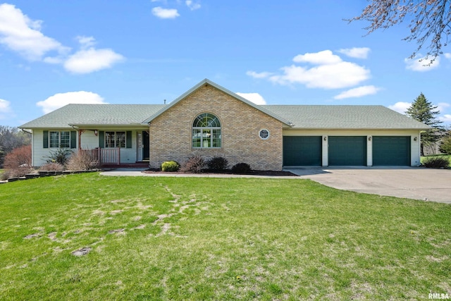 single story home with a front lawn, driveway, a porch, brick siding, and an attached garage