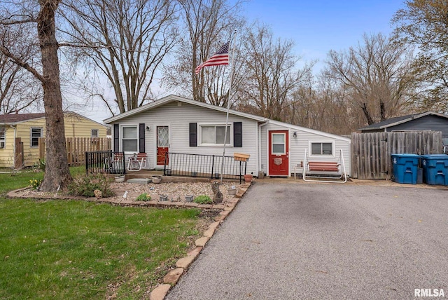 view of front of property with fence and a front yard