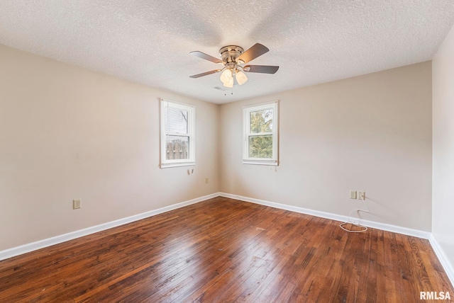 empty room with hardwood / wood-style floors, a textured ceiling, a ceiling fan, and baseboards