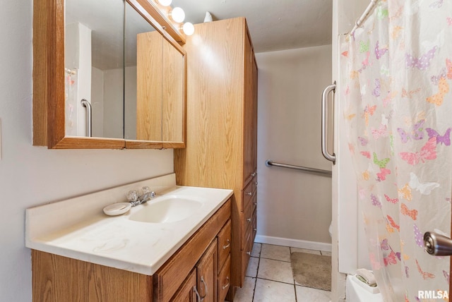 bathroom with a shower with curtain, tile patterned floors, and vanity