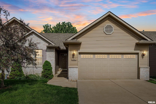 1357 Pinnacle Pines Ct, Bettendorf, IA 52722 - ranch-style home featuring driveway, an attached garage, a shingled roof, and a front yard