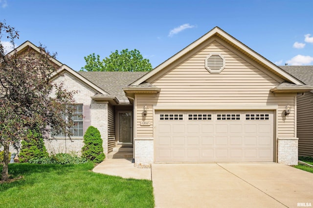 1357 Pinnacle Pines Ct, Bettendorf, IA 52722 - single story home featuring driveway, a garage, brick siding, and roof with shingles