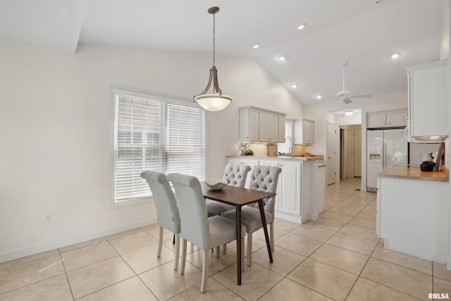 1357 Pinnacle Pines Ct, Bettendorf, IA 52722 - dining room featuring lofted ceiling, light tile patterned floors, a ceiling fan, recessed lighting, and baseboards