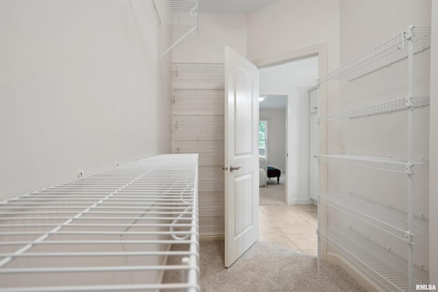 1357 Pinnacle Pines Ct, Bettendorf, IA 52722 - hallway with light carpet and light tile patterned floors
