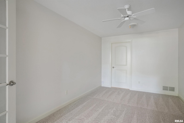 1357 Pinnacle Pines Ct, Bettendorf, IA 52722 - spare room featuring carpet flooring, baseboards, and ceiling fan