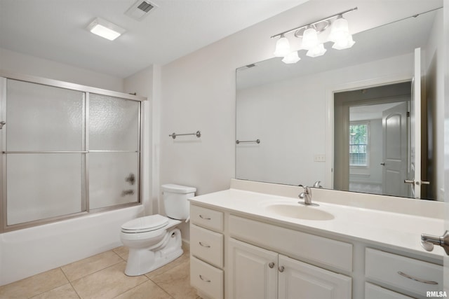 1357 Pinnacle Pines Ct, Bettendorf, IA 52722 - full bathroom featuring vanity, toilet, tile patterned floors, and shower / bath combination with glass door