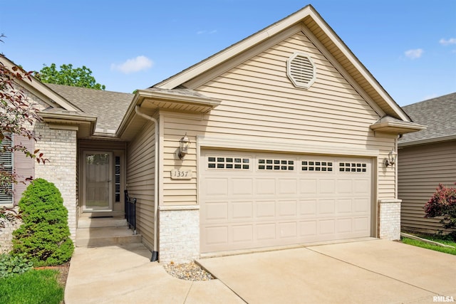1357 Pinnacle Pines Ct, Bettendorf, IA 52722 - view of front facade featuring roof with shingles, an attached garage, and concrete driveway