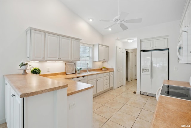 1357 Pinnacle Pines Ct, Bettendorf, IA 52722 - kitchen featuring white appliances, light tile patterned flooring, a peninsula, a ceiling fan, and a sink