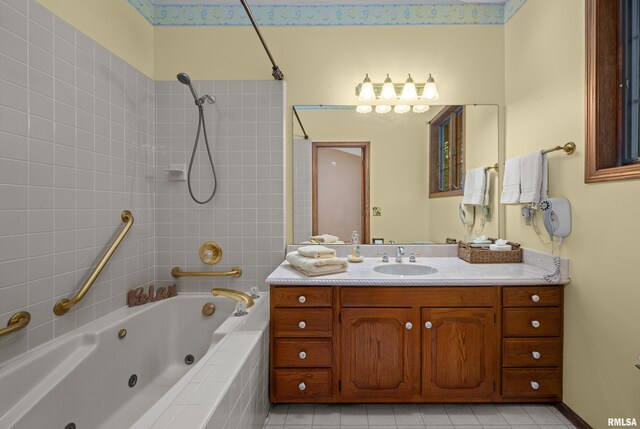 laundry room with separate washer and dryer, cabinet space, and wallpapered walls