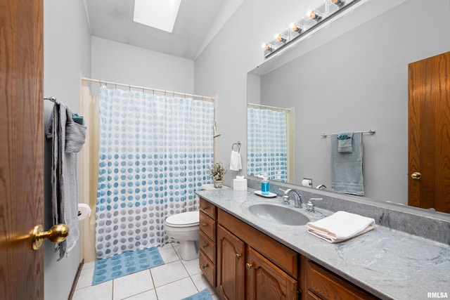 full bathroom with vanity, toilet, tile patterned floors, a shower with shower curtain, and a skylight