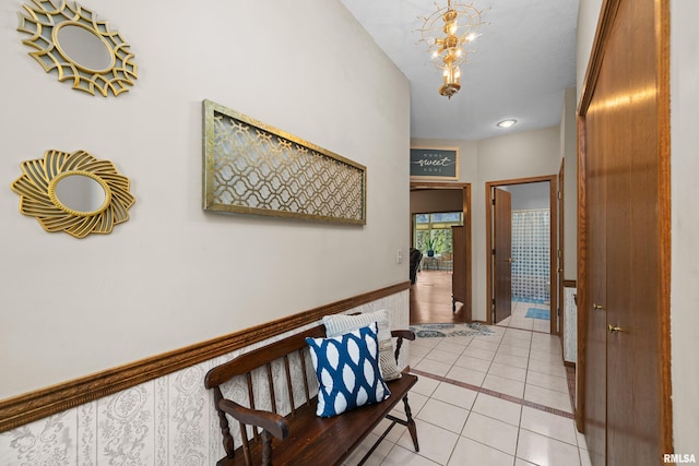 interior space with an inviting chandelier and light tile patterned flooring
