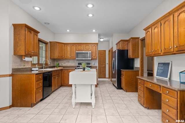 kitchen featuring brown cabinets, tasteful backsplash, and stainless steel appliances