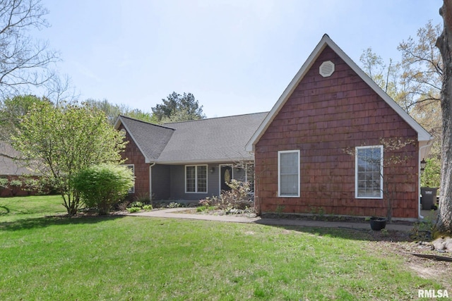 409 Arbor Dr, Carterville, IL 62918 - view of front facade with roof with shingles and a front lawn