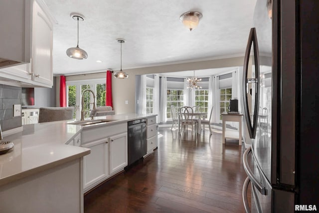 409 Arbor Dr, Carterville, IL 62918 - kitchen with a peninsula, white cabinetry, stainless steel appliances, and a sink