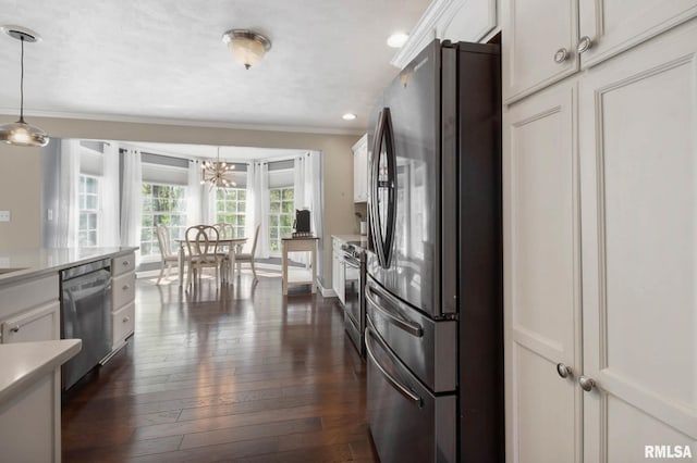 409 Arbor Dr, Carterville, IL 62918 - kitchen with stainless steel appliances, light countertops, ornamental molding, dark wood-style flooring, and white cabinetry