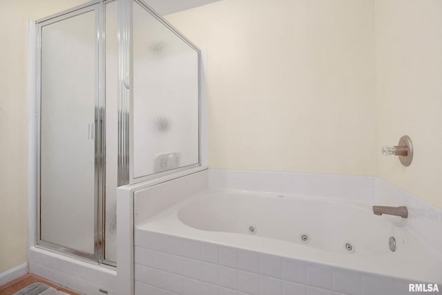 409 Arbor Dr, Carterville, IL 62918 - full bathroom featuring a tub with jets and a stall shower
