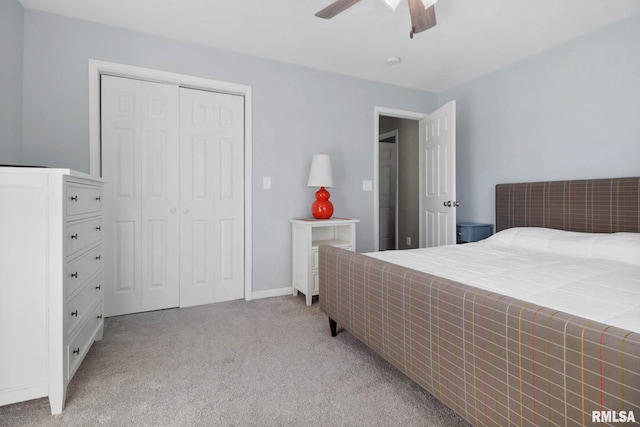 409 Arbor Dr, Carterville, IL 62918 - bedroom with ceiling fan, a closet, and light carpet