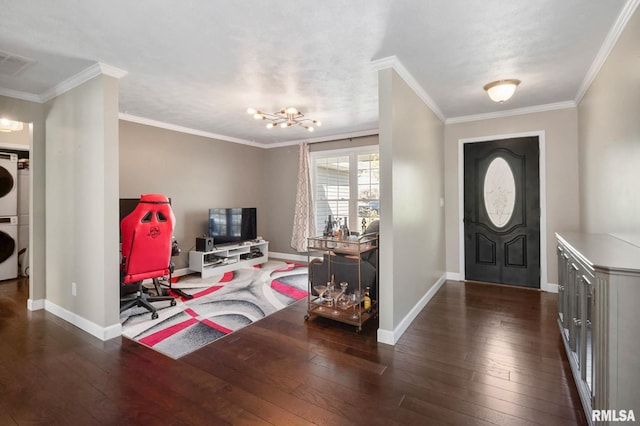 409 Arbor Dr, Carterville, IL 62918 - entryway with stacked washer and clothes dryer, hardwood / wood-style floors, visible vents, and a notable chandelier
