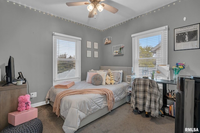bedroom with carpet floors, ceiling fan, and multiple windows