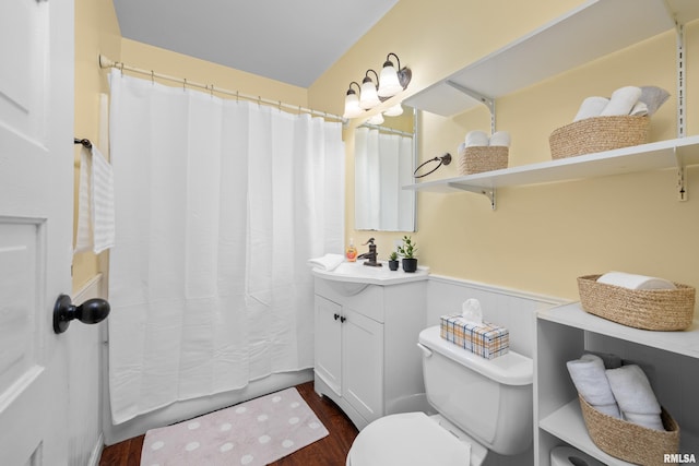 2302 Western Ave, Davenport, IA 52803 - full bath with wood finished floors, vanity, and a shower with curtain