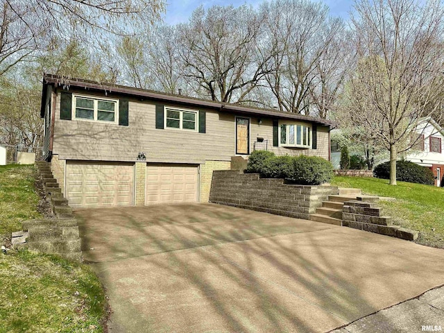 view of front of house with an attached garage and concrete driveway