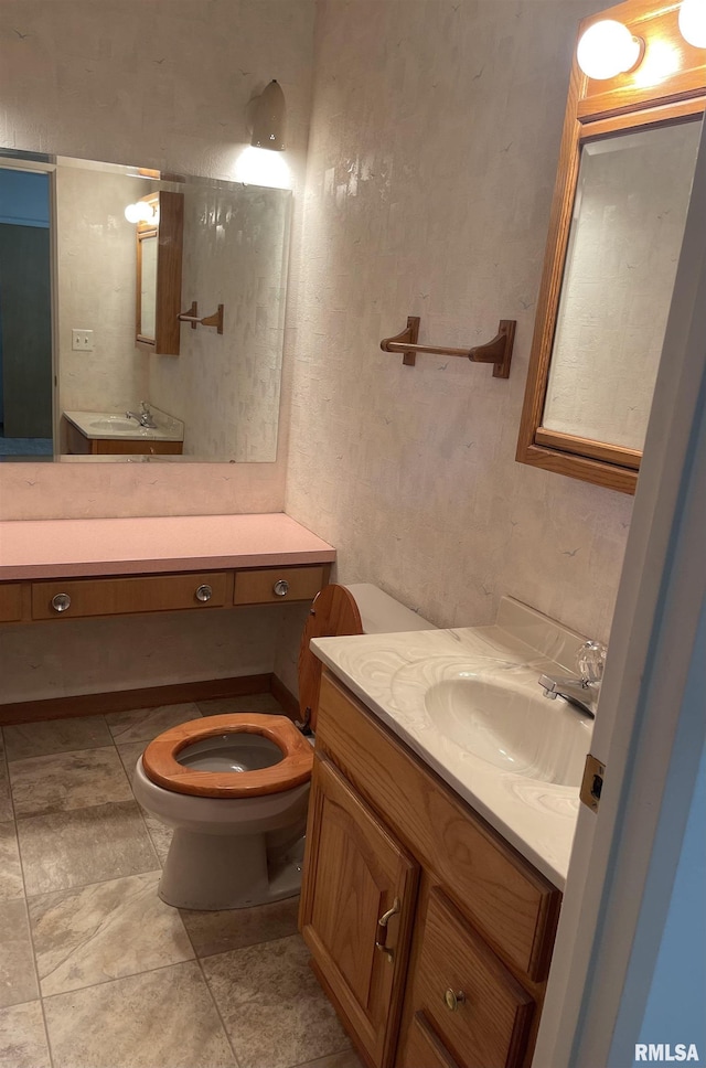 1725 Elmwood Ln, Bettendorf, IA 52722 - bathroom with toilet, vanity, and a textured wall
