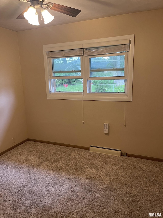 1725 Elmwood Ln, Bettendorf, IA 52722 - empty room featuring a baseboard radiator, carpet, healthy amount of natural light, and ceiling fan