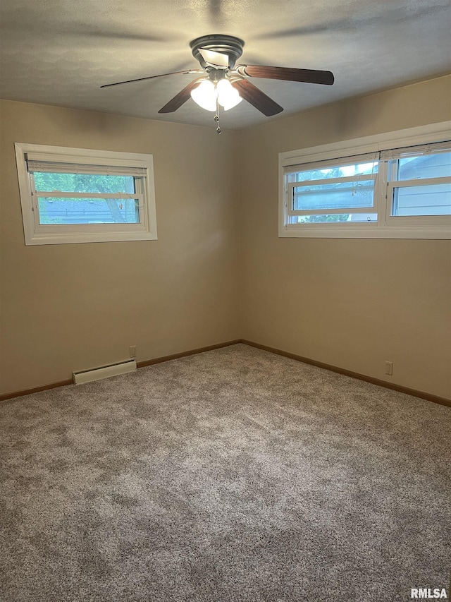 1725 Elmwood Ln, Bettendorf, IA 52722 - carpeted empty room featuring baseboard heating, baseboards, and a ceiling fan