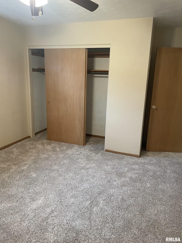 1725 Elmwood Ln, Bettendorf, IA 52722 - unfurnished bedroom with carpet floors, a closet, baseboards, and a ceiling fan
