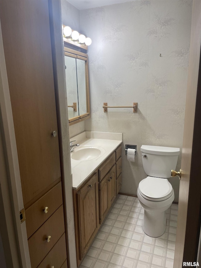 1725 Elmwood Ln, Bettendorf, IA 52722 - bathroom featuring vanity, toilet, and tile patterned floors
