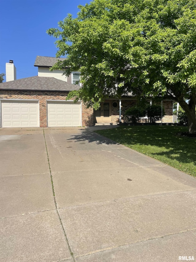 5833 Taylor St, Davenport, IA 52806 - view of front of property with brick siding, driveway, a front yard, and a shingled roof